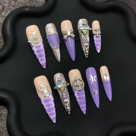long stiletto press on glue nails purple nude glam luxury nails faux 3d art rhinestones bow trendy star edgy futuristic planetary cosplay