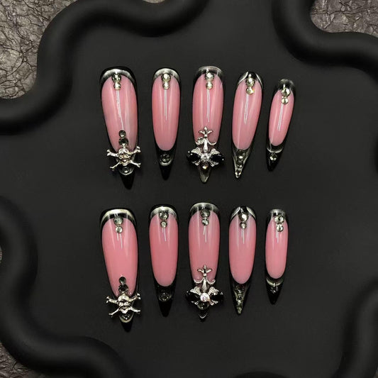 Pink nails gothic black French tips stiletto skull nail art, cross embellishments, edgy luxury nail, punk aesthetic metallic accent press on