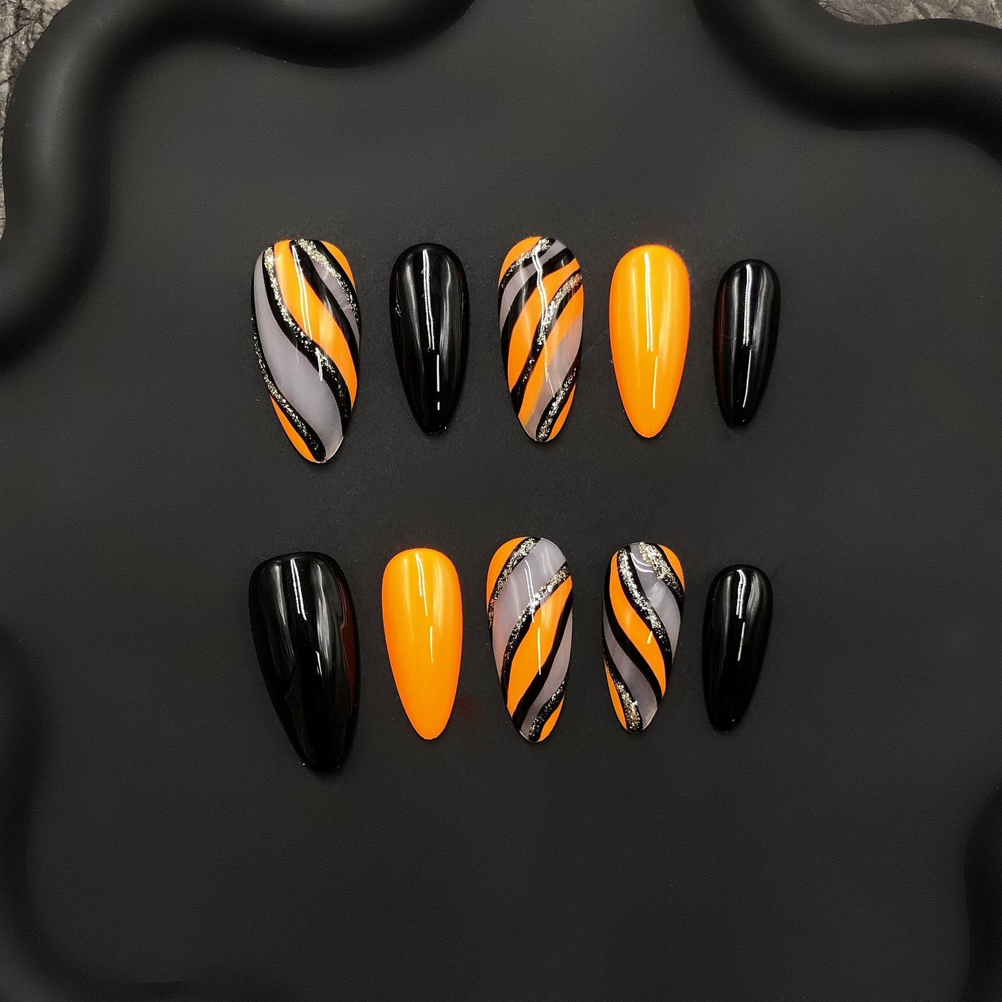 Halloween Hand Painted Press On Nails – Orange & Black Swirl Design, Glossy Almond Nails with Glitter Accents, Spooky Season Fake Nail Set