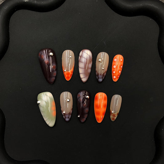 Handmade Marble and Flame Press On Nails Orange Gray & Neutral Tones with Chrome Stud Accents. Halloween edgy fake nails fall hand painted