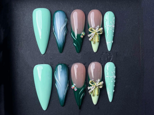green gradient nails, mint and emerald nails, 3D bow art nude and green winter snowflake art press-on rhinestone holiday elegant green