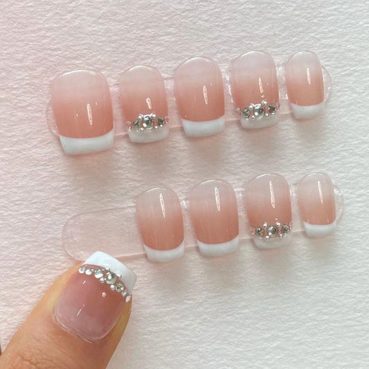 Elegant French Tip Press-On Nails with Rhinestone Accent – Short Square. Artificial reusable fake glue on faux manicure nails trendy art