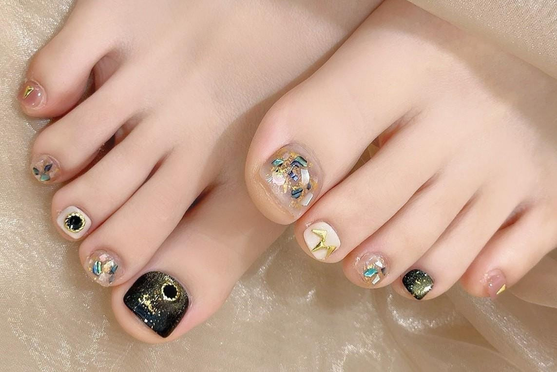 Celestial Sparkle Press-On Toe Nails–Black, Nude & Gold Foil Set glue on artificial faux nails starry holographic cosmic night toe nail art