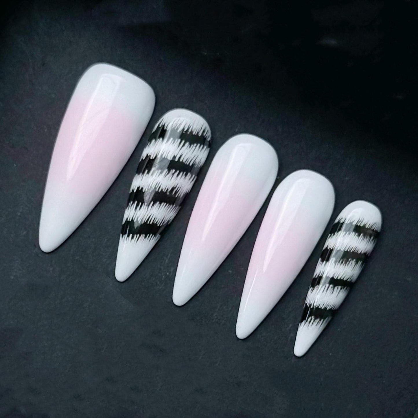 Pink and White Ombre Press On Nails with Black Abstract Zebra Stripe Accent. Artificial reusable fake glue on faux manicure nail trendy art.