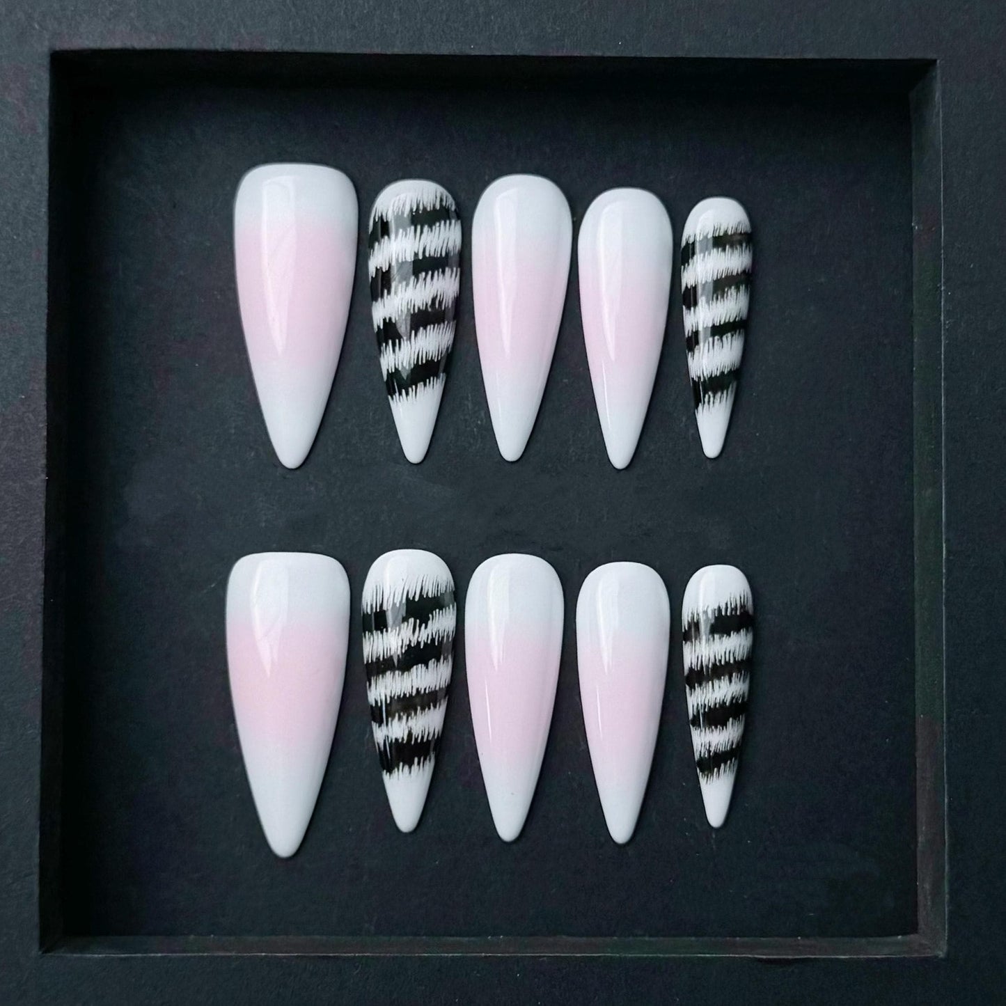 Pink and White Ombre Press On Nails with Black Abstract Zebra Stripe Accent. Artificial reusable fake glue on faux manicure nail trendy art.