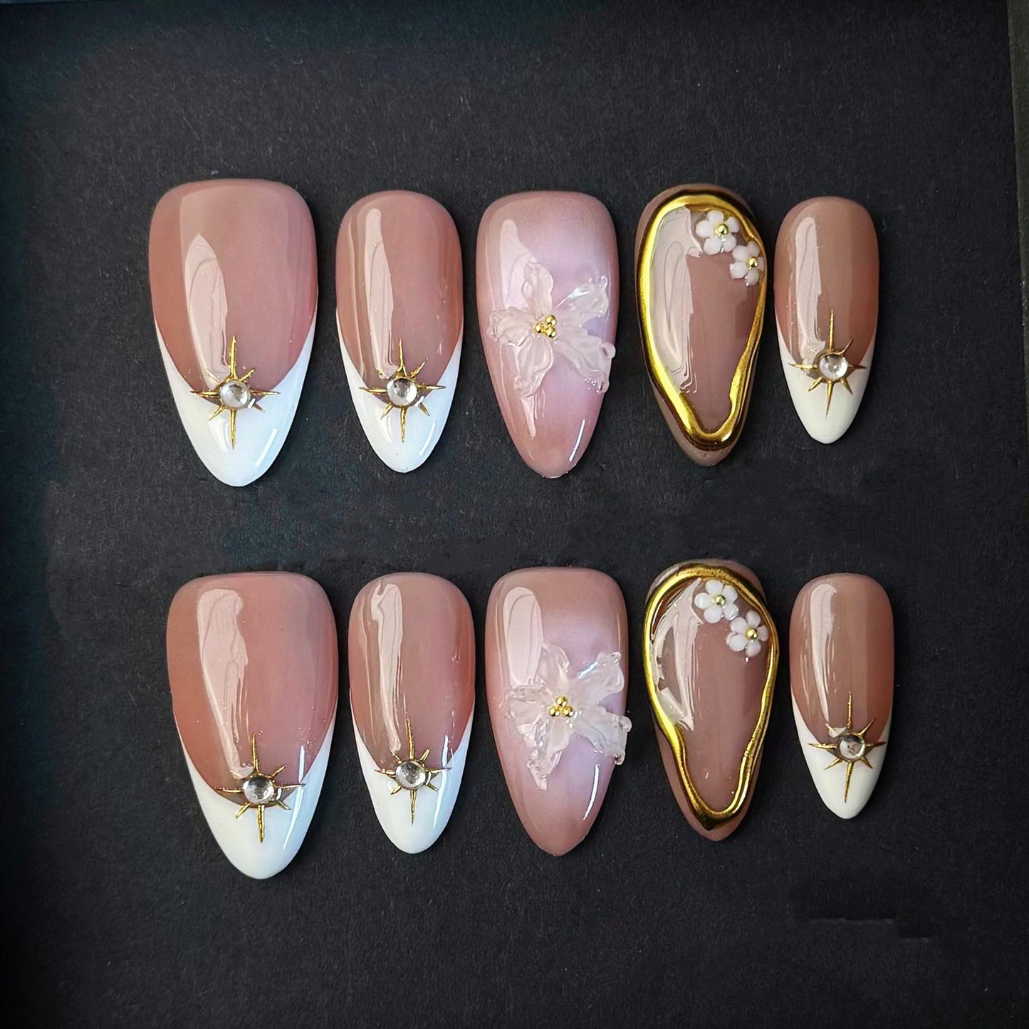 Elegant Nude Press On Nails with 3D Flower Gold Accents French Tips and Pearl Charms. Artificial fake glue on faux manicure nail trendy art.