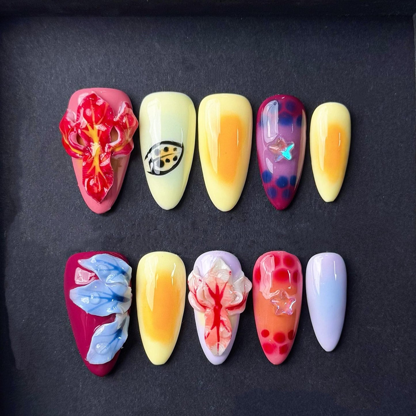 Tropical Sunset Press On Nails with 3D Flowers Fruit-Inspired Art and Star Accents. Artificial fake glue on faux manicure nails trendy art.