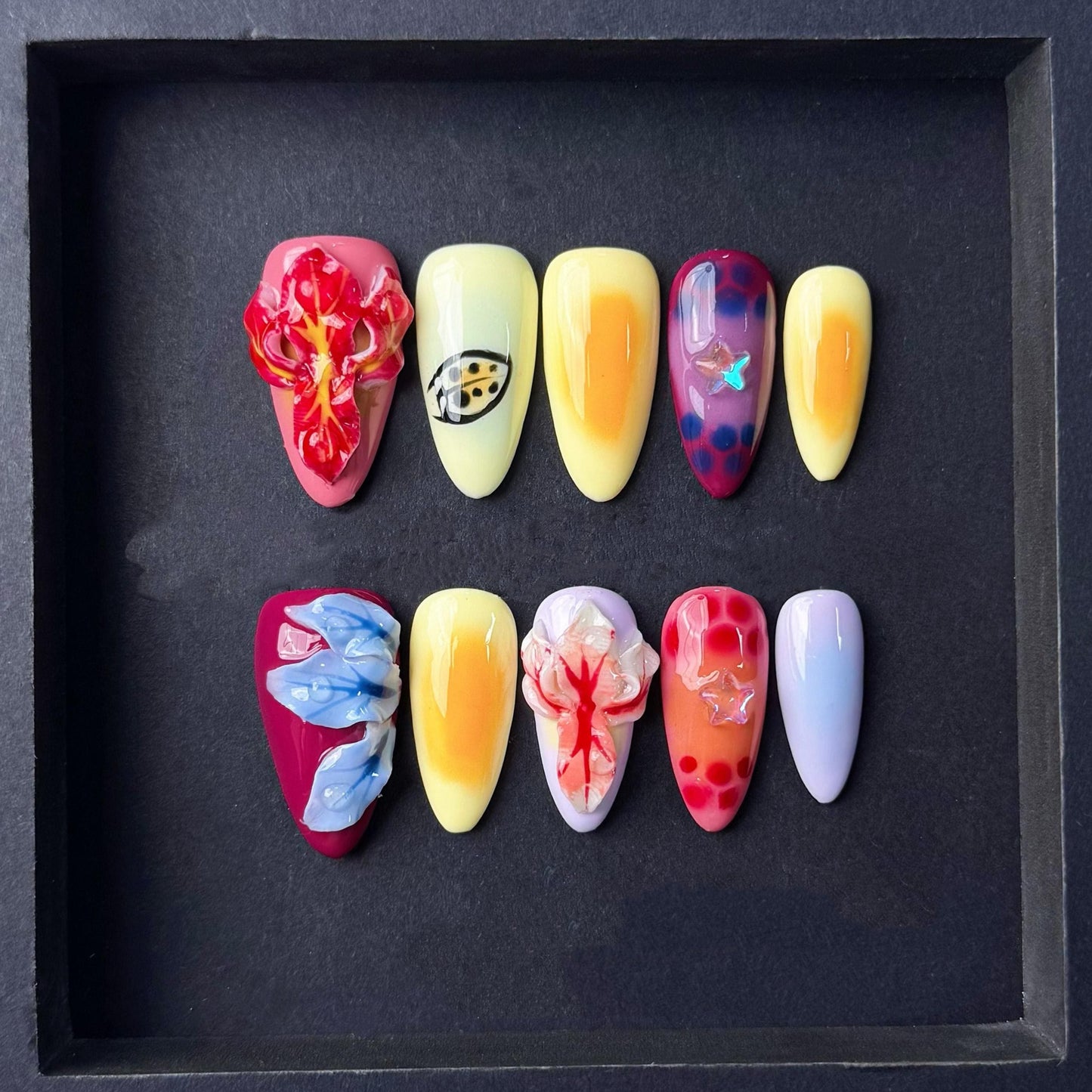 Tropical Sunset Press On Nails with 3D Flowers Fruit-Inspired Art and Star Accents. Artificial fake glue on faux manicure nails trendy art.