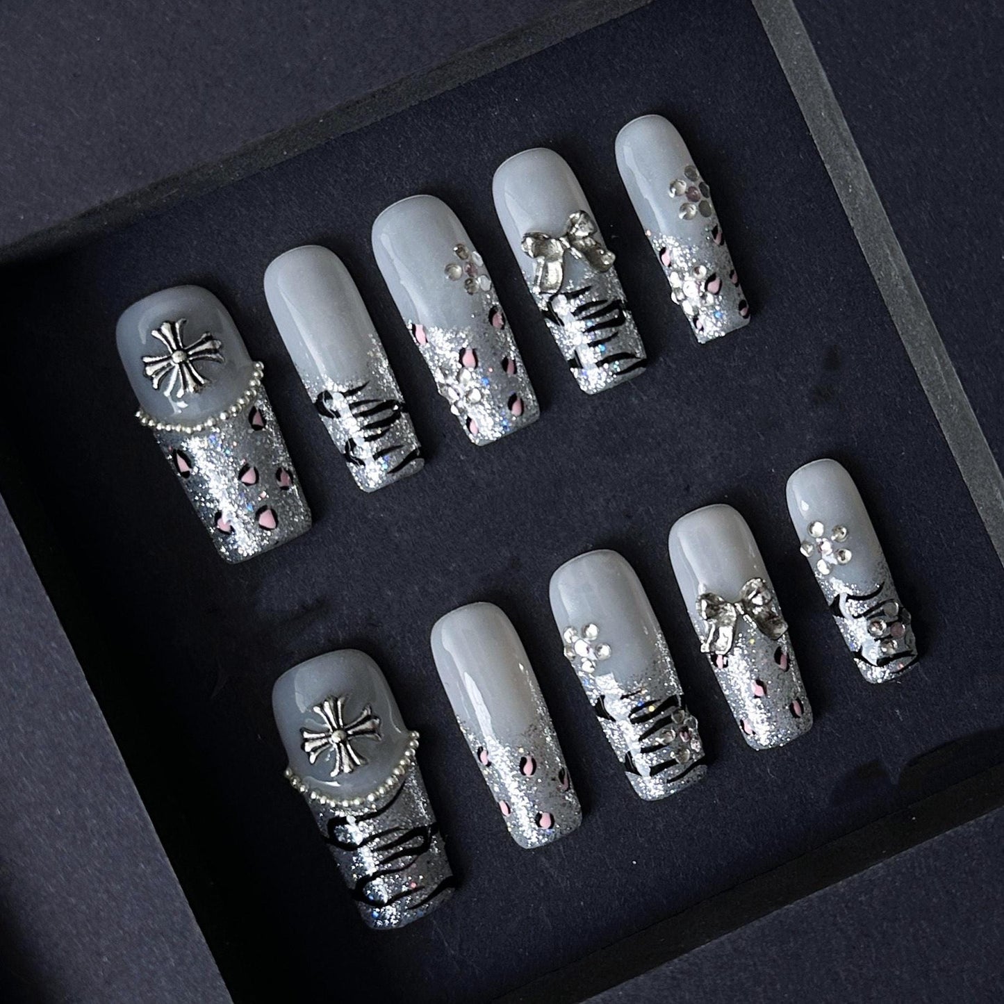 Gothic Glitter Silver Press On Nails with Cross, Bows, and Rhinestones. Artificial reusable fake glue on faux manicure nails trendy art.