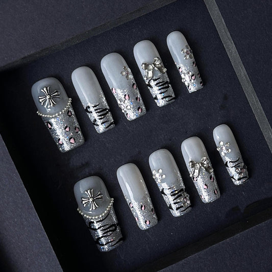 Gothic Glitter Silver Press On Nails with Cross, Bows, and Rhinestones. Artificial reusable fake glue on faux manicure nails trendy art.
