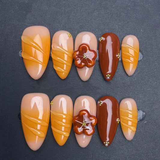 Pumpkin Spice Swirl Press On Nails–Autumn Floral Accent Set in Orange & Brown. Artificial reusable glue on faux manicure nails trendy art.
