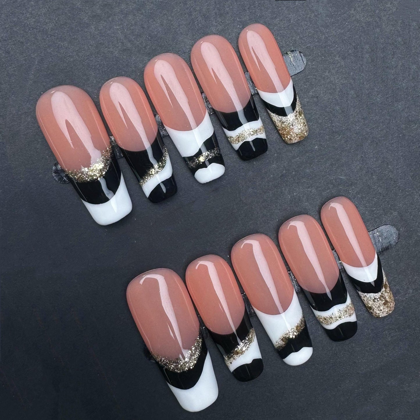 Elegant Black White and Gold French Tip Press-On Nails. Artificial reusable fake glue on faux manicure nails trendy art.