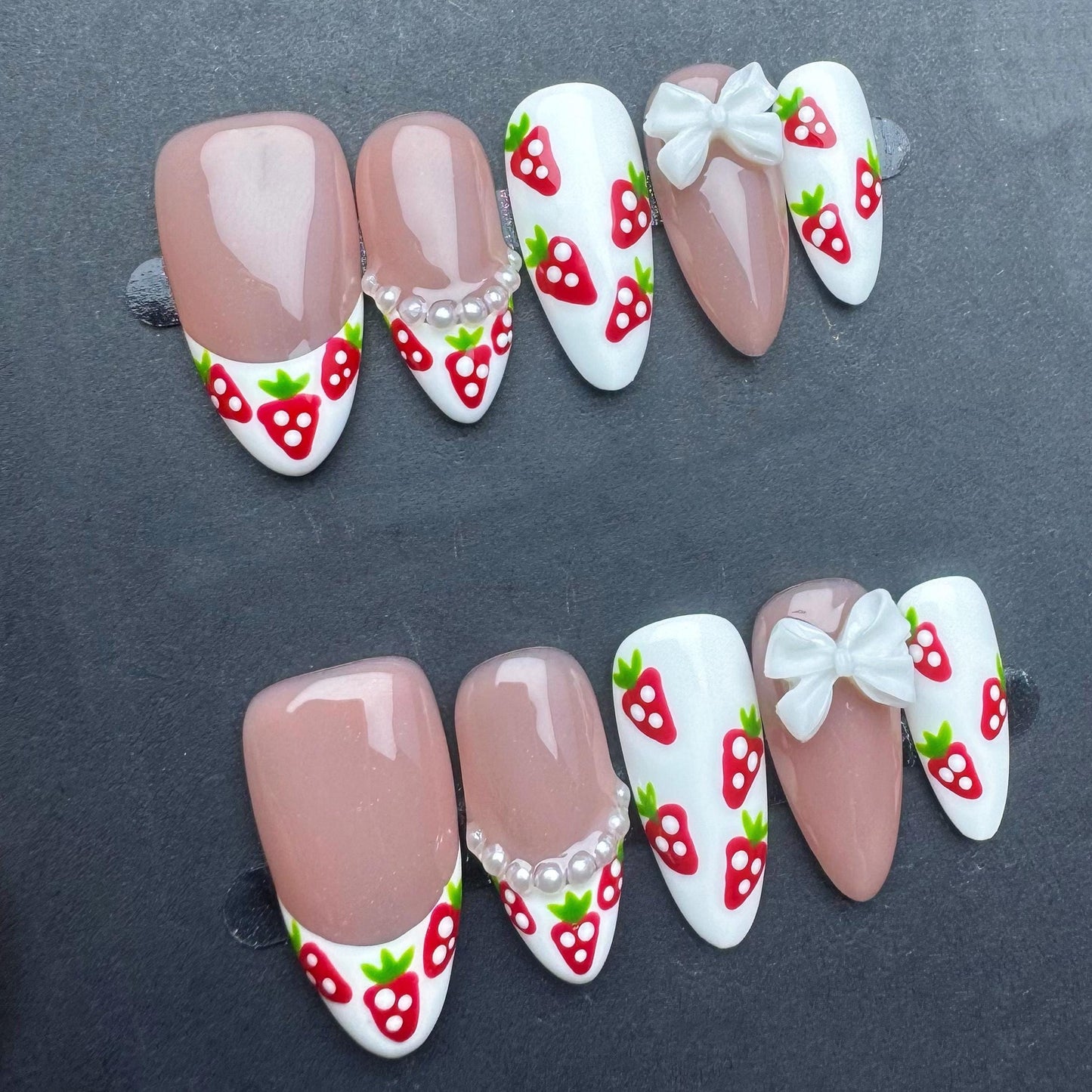 Cute Strawberry French Tip Nails with Pearls and Bows. Kawaii Press-On Set. Artificial reusable fake glue on faux manicure nails trendy art.