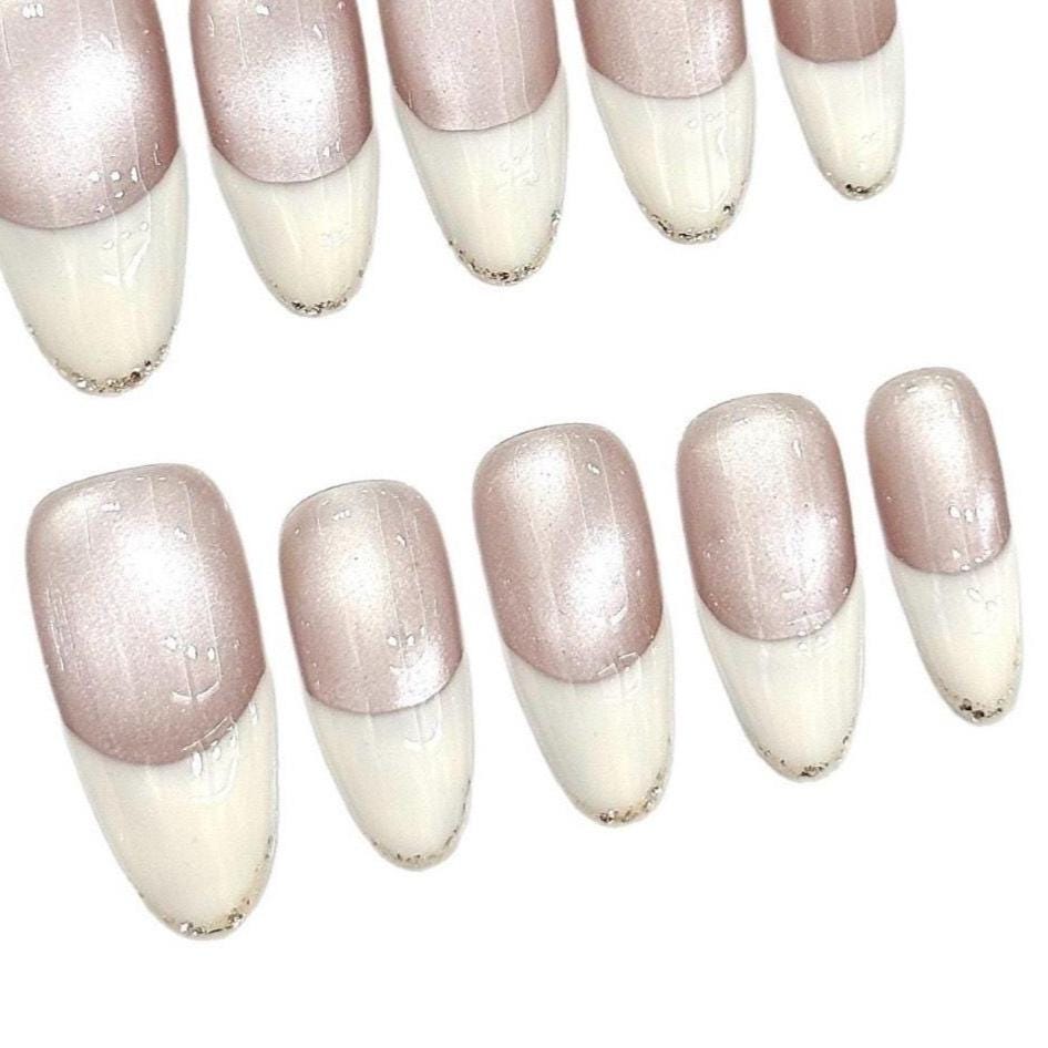 Champagne Pearl French Tip Press-On Nails – Oval Shimmer with Gold Detail. Artificial reusable fake glue on faux manicure nails trendy art