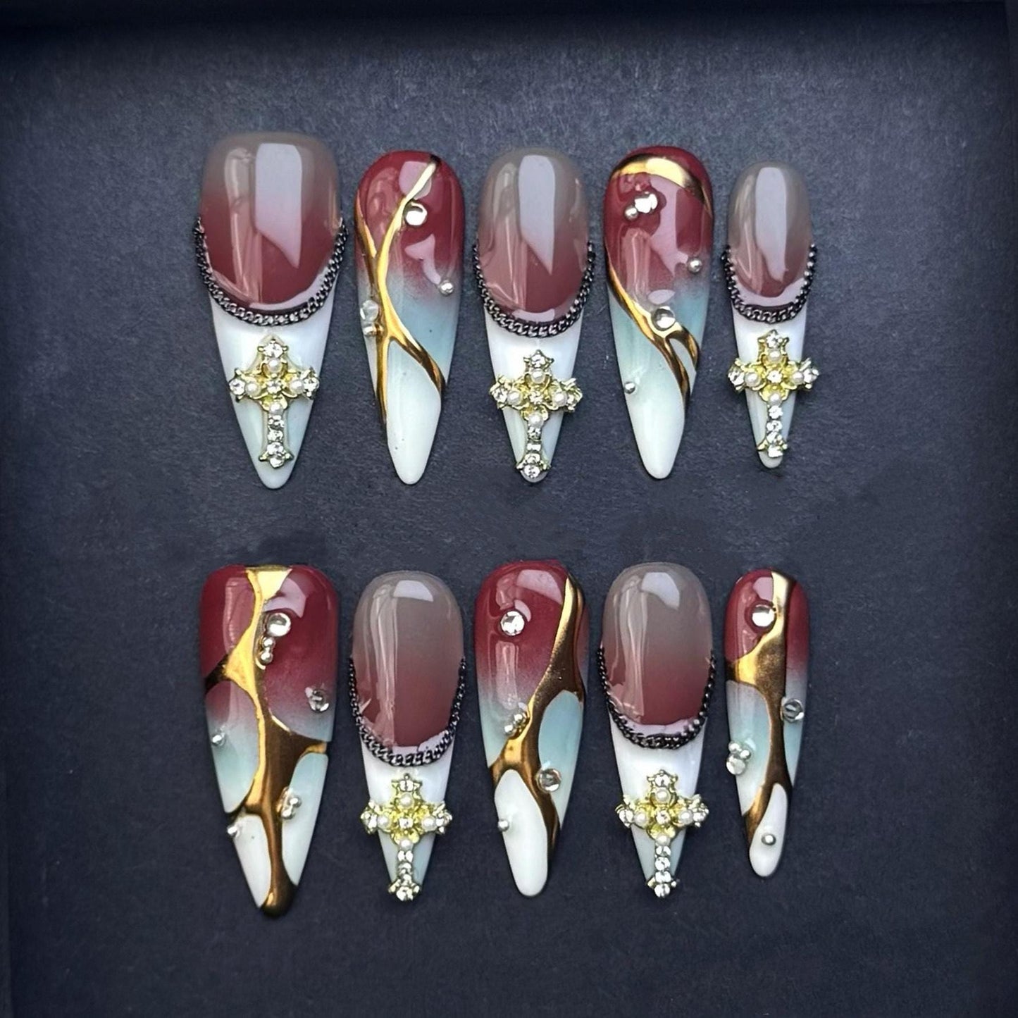 Gothic Elegance Press-On Nails with Gold Cross Charms. Burgundy and Marble Stiletto Set. Artificial reusable glue on faux nails trendy art.