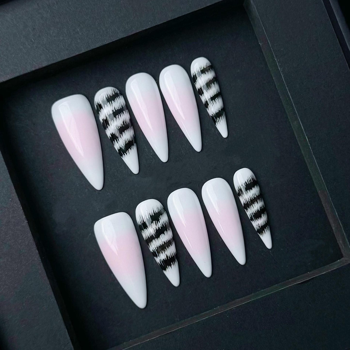 Pink and White Ombre Press On Nails with Black Abstract Zebra Stripe Accent. Artificial reusable fake glue on faux manicure nail trendy art.