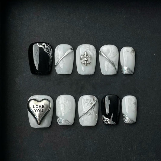 Monochrome Marble Press On Nails with Silver Charms LOVE Heart and Metallic Accents. Artificial fake glue on faux manicure nails trendy art.