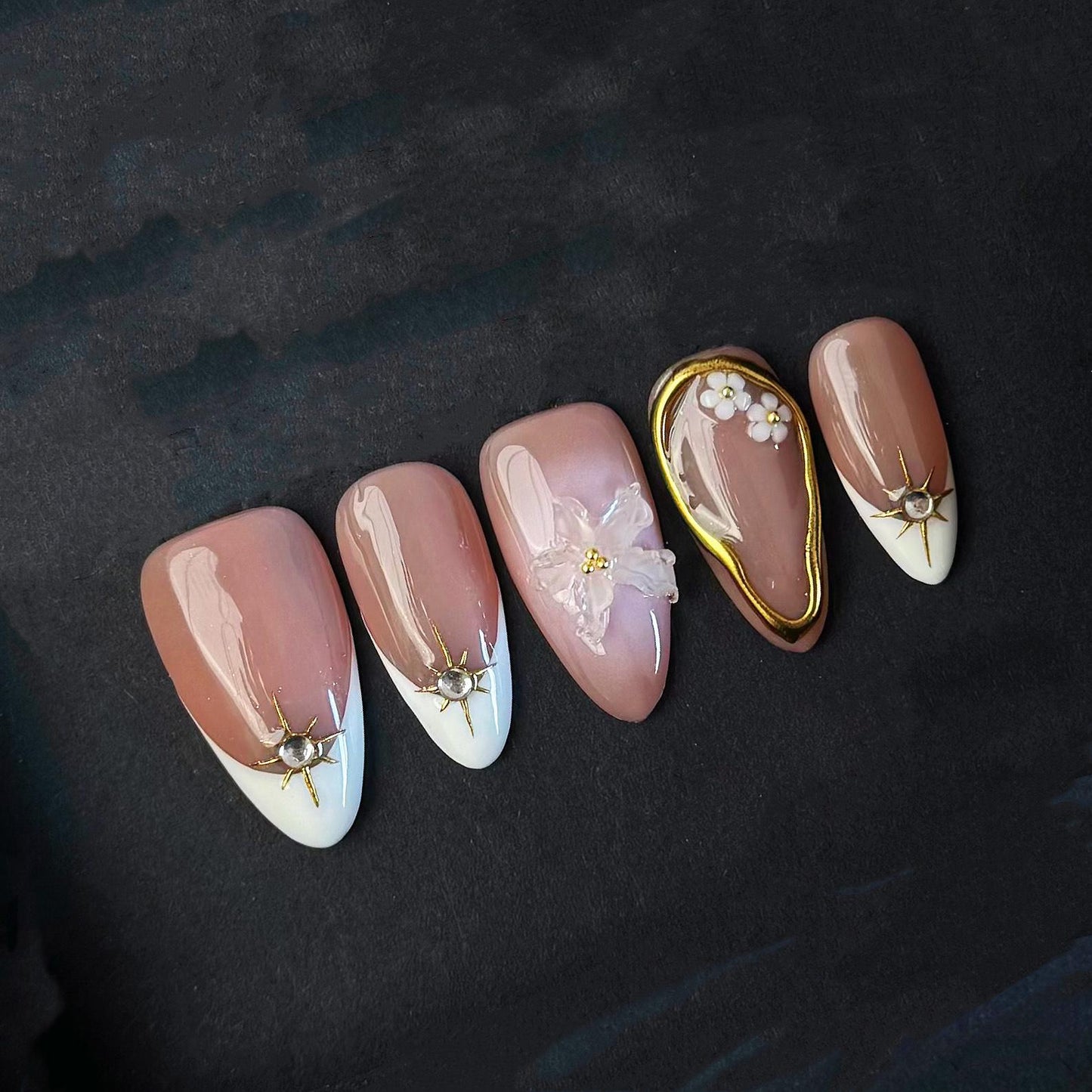 Elegant Nude Press On Nails with 3D Flower Gold Accents French Tips and Pearl Charms. Artificial fake glue on faux manicure nail trendy art.