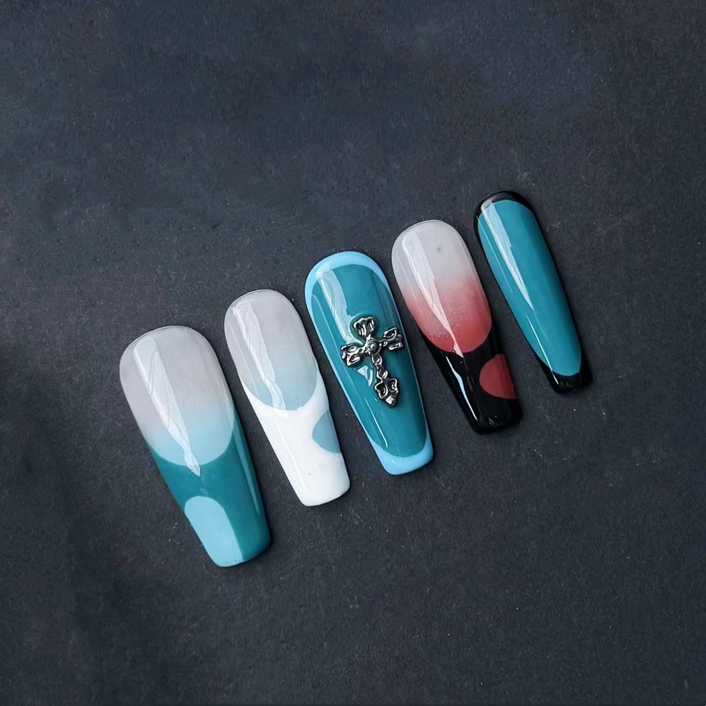 Modern Abstract Press On Nails with Cross Charm Red Teal and Sky Blue Color Blocking. Artificial fake glue on faux manicure nail trendy art.