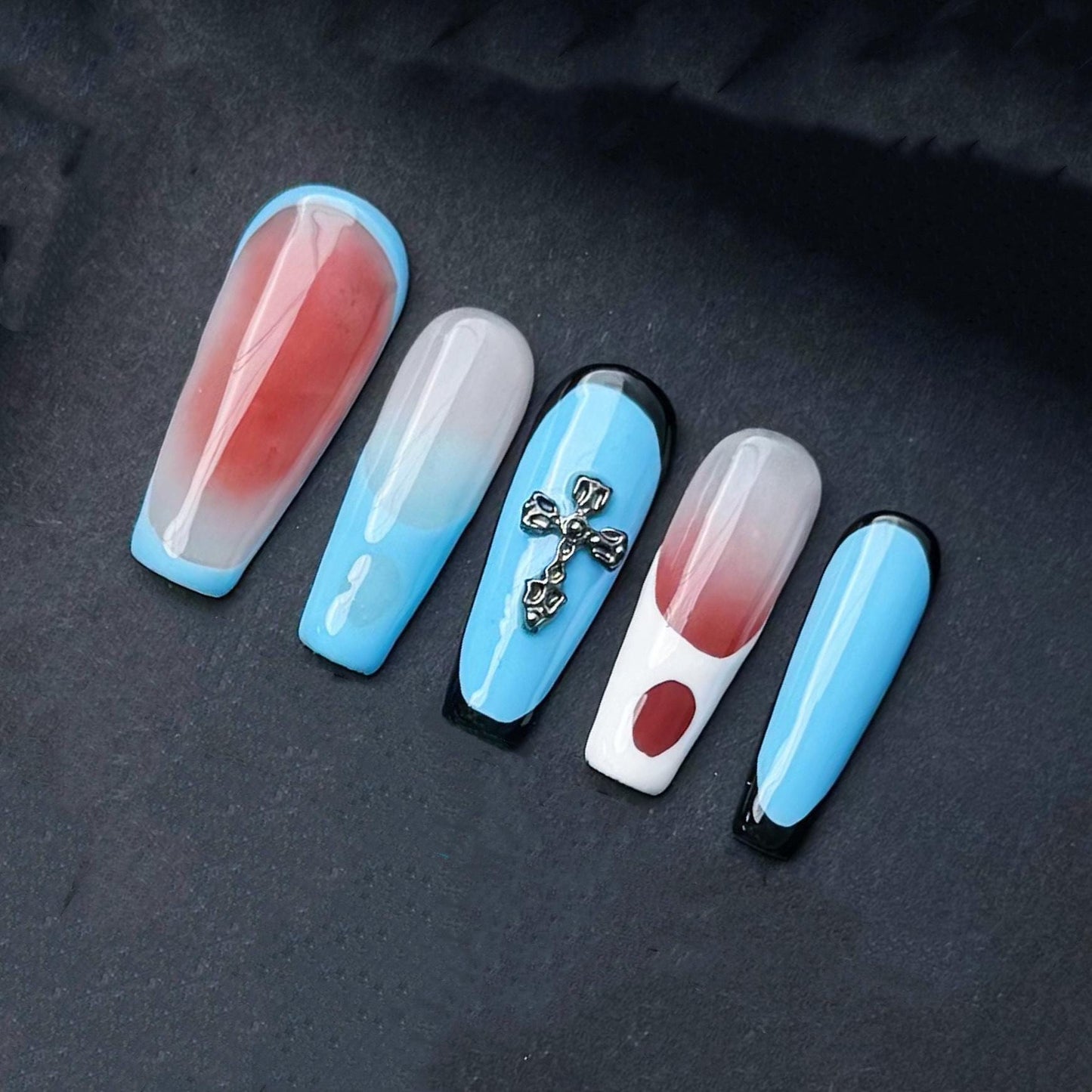 Modern Abstract Press On Nails with Cross Charm Red Teal and Sky Blue Color Blocking. Artificial fake glue on faux manicure nail trendy art.