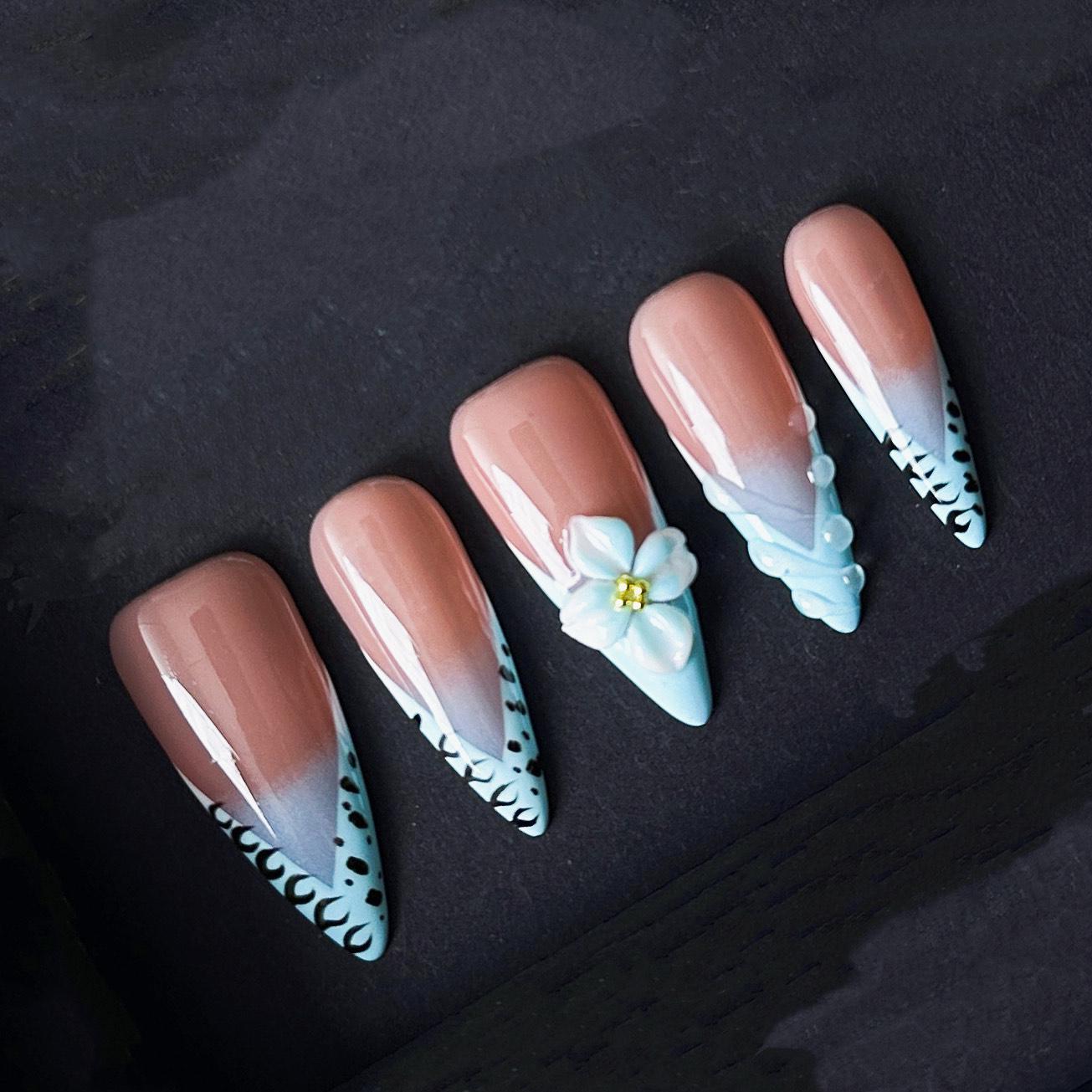 Blue French Tip Press On Nails with Leopard Edges and 3D White Flower Accents. Artificial reusable fake glue on manicure nails trendy art.