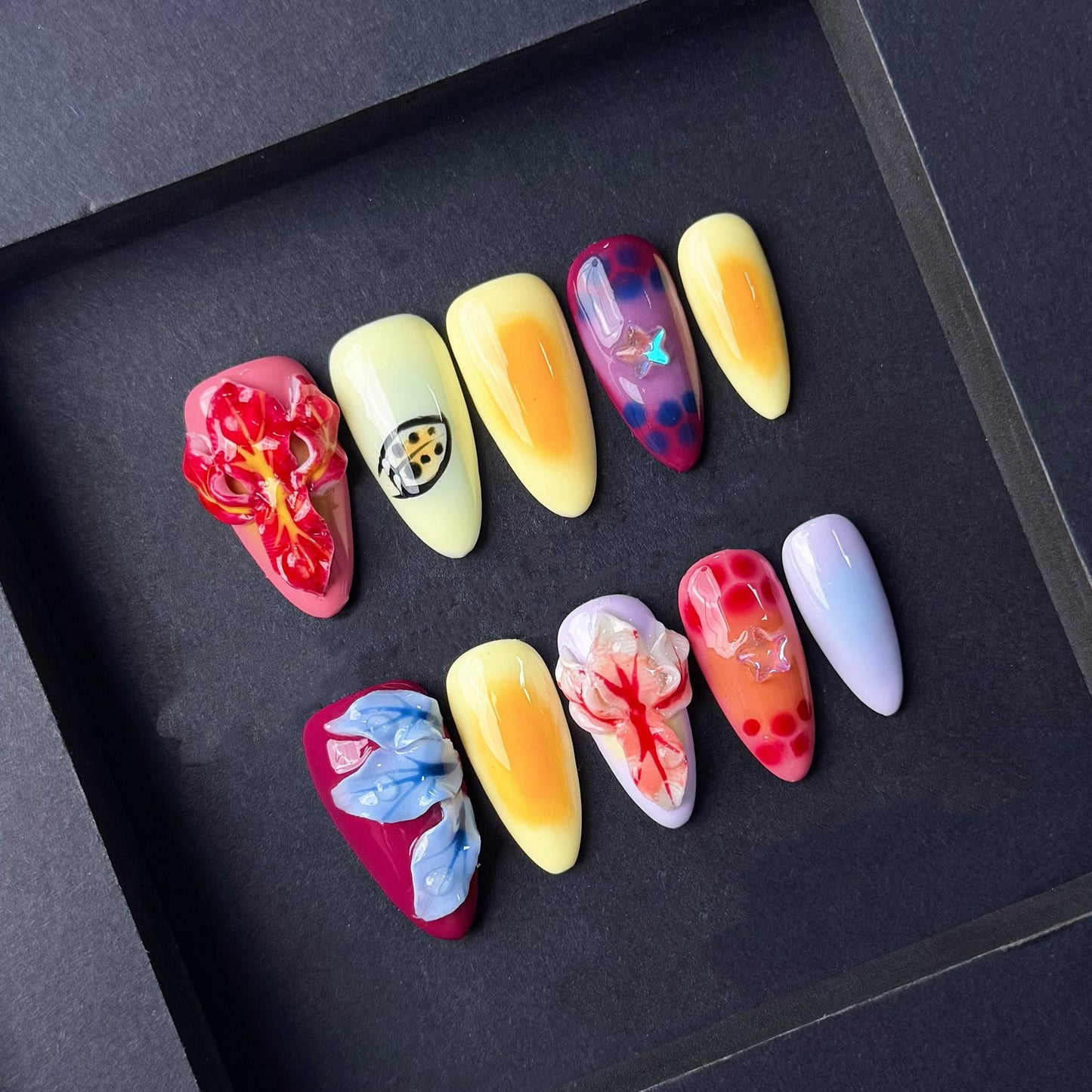 Tropical Sunset Press On Nails with 3D Flowers Fruit-Inspired Art and Star Accents. Artificial fake glue on faux manicure nails trendy art.