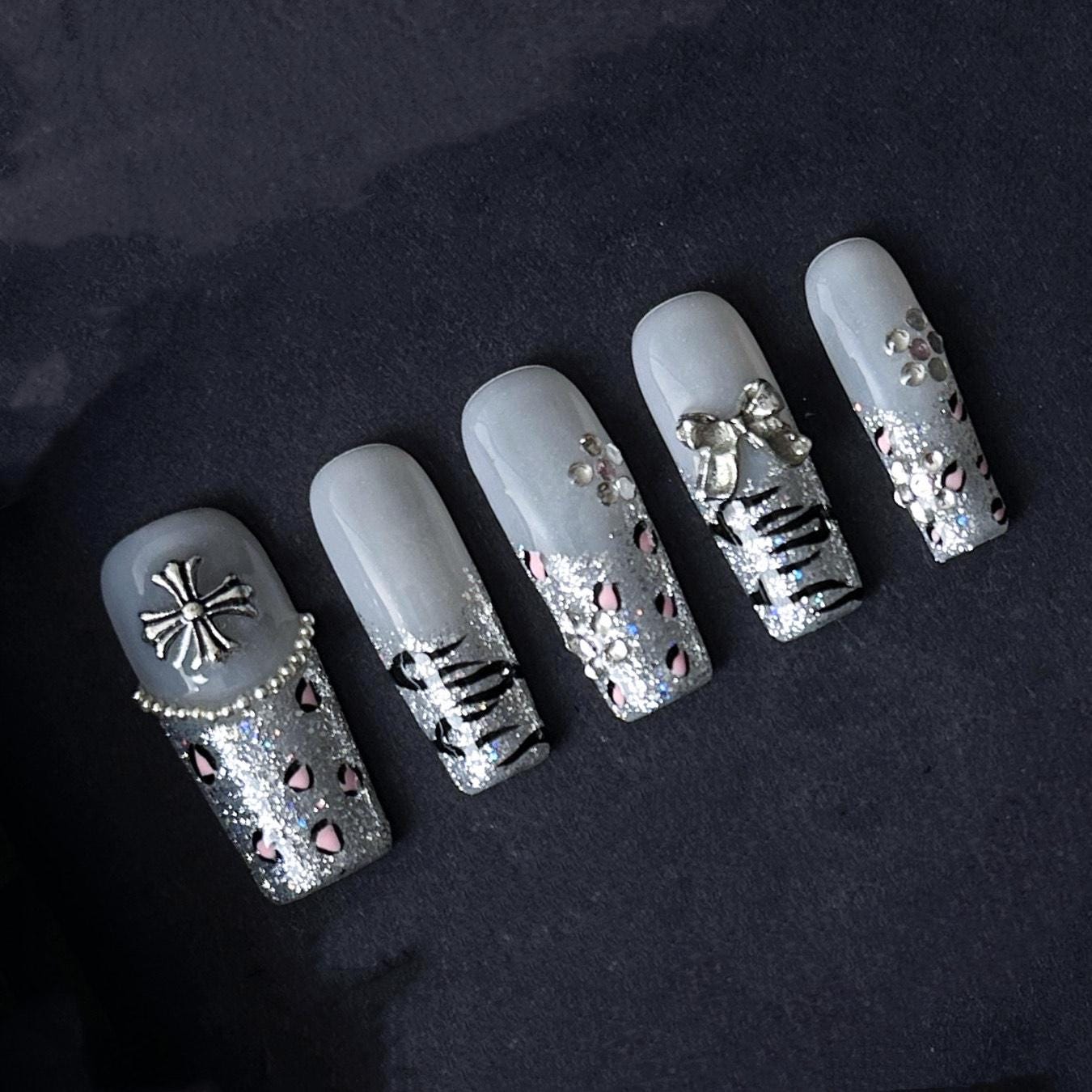 Gothic Glitter Silver Press On Nails with Cross, Bows, and Rhinestones. Artificial reusable fake glue on faux manicure nails trendy art.