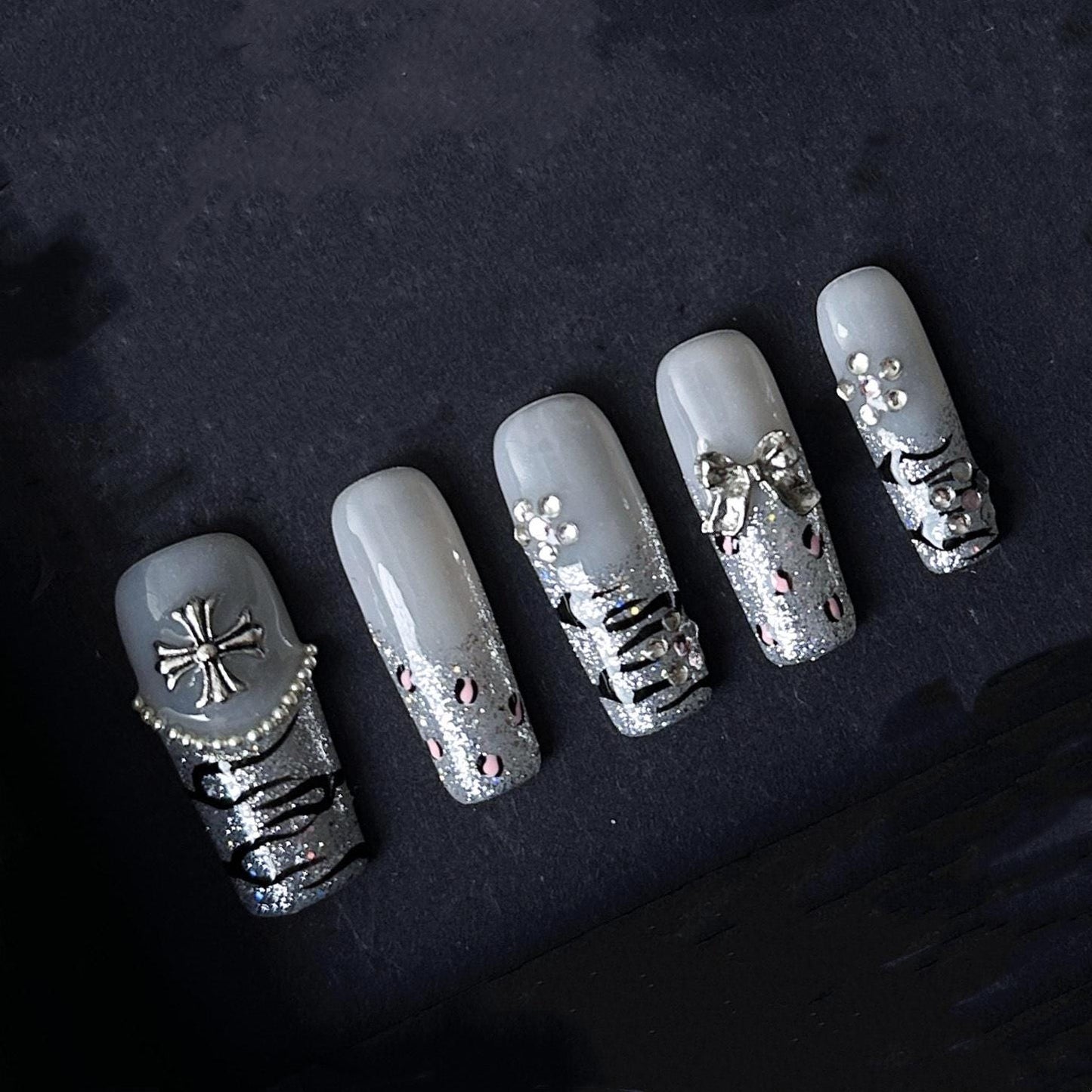 Gothic Glitter Silver Press On Nails with Cross, Bows, and Rhinestones. Artificial reusable fake glue on faux manicure nails trendy art.