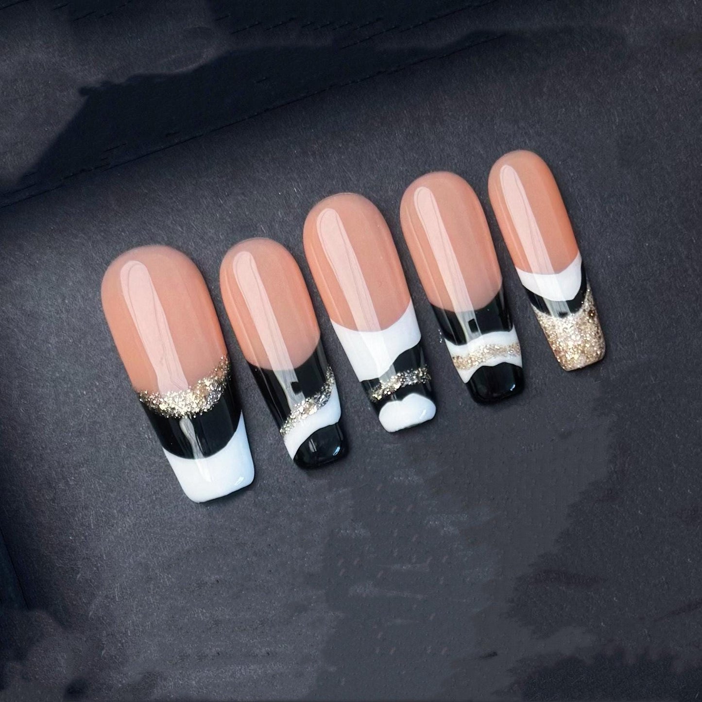 Elegant Black White and Gold French Tip Press-On Nails. Artificial reusable fake glue on faux manicure nails trendy art.