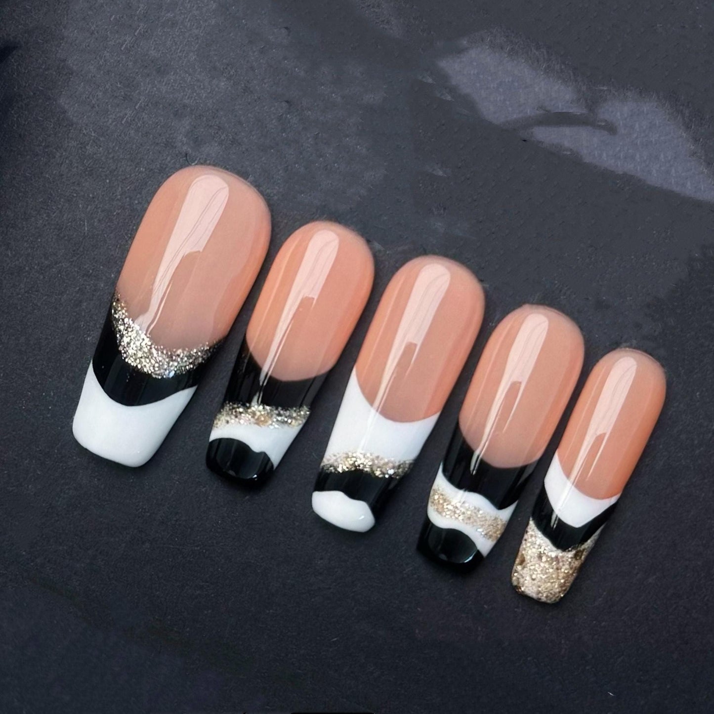 Elegant Black White and Gold French Tip Press-On Nails. Artificial reusable fake glue on faux manicure nails trendy art.