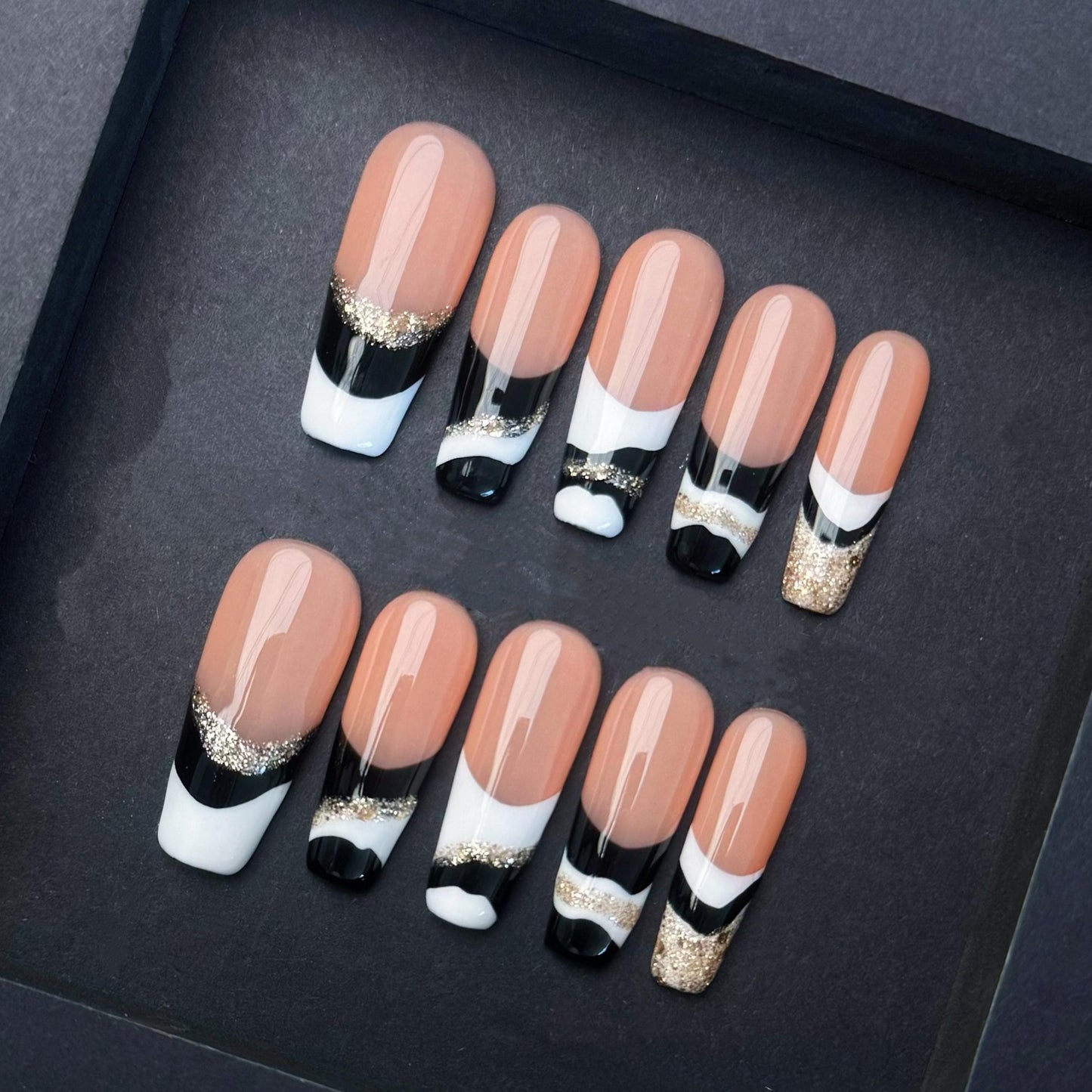 Elegant Black White and Gold French Tip Press-On Nails. Artificial reusable fake glue on faux manicure nails trendy art.