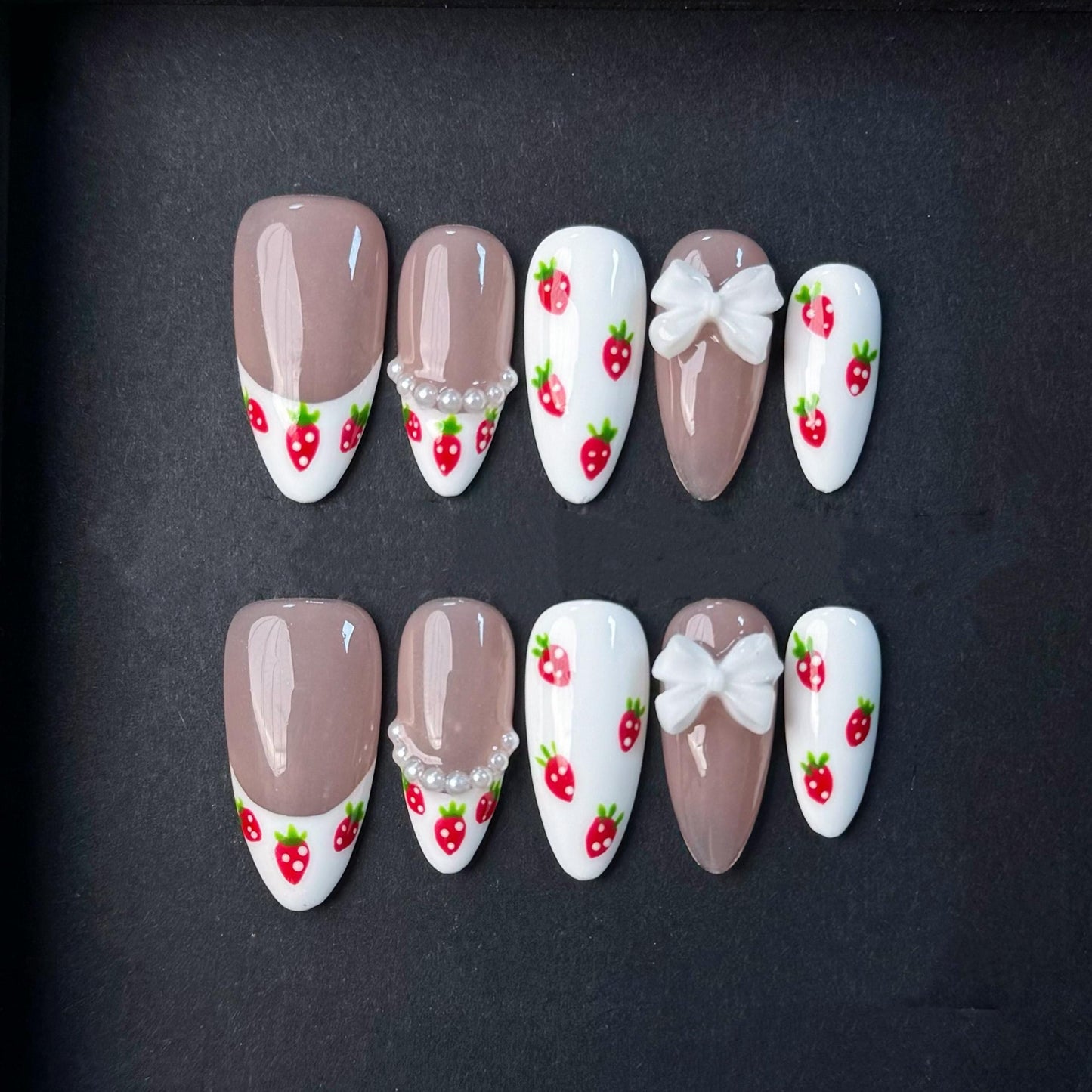Cute Strawberry French Tip Nails with Pearls and Bows. Kawaii Press-On Set. Artificial reusable fake glue on faux manicure nails trendy art.