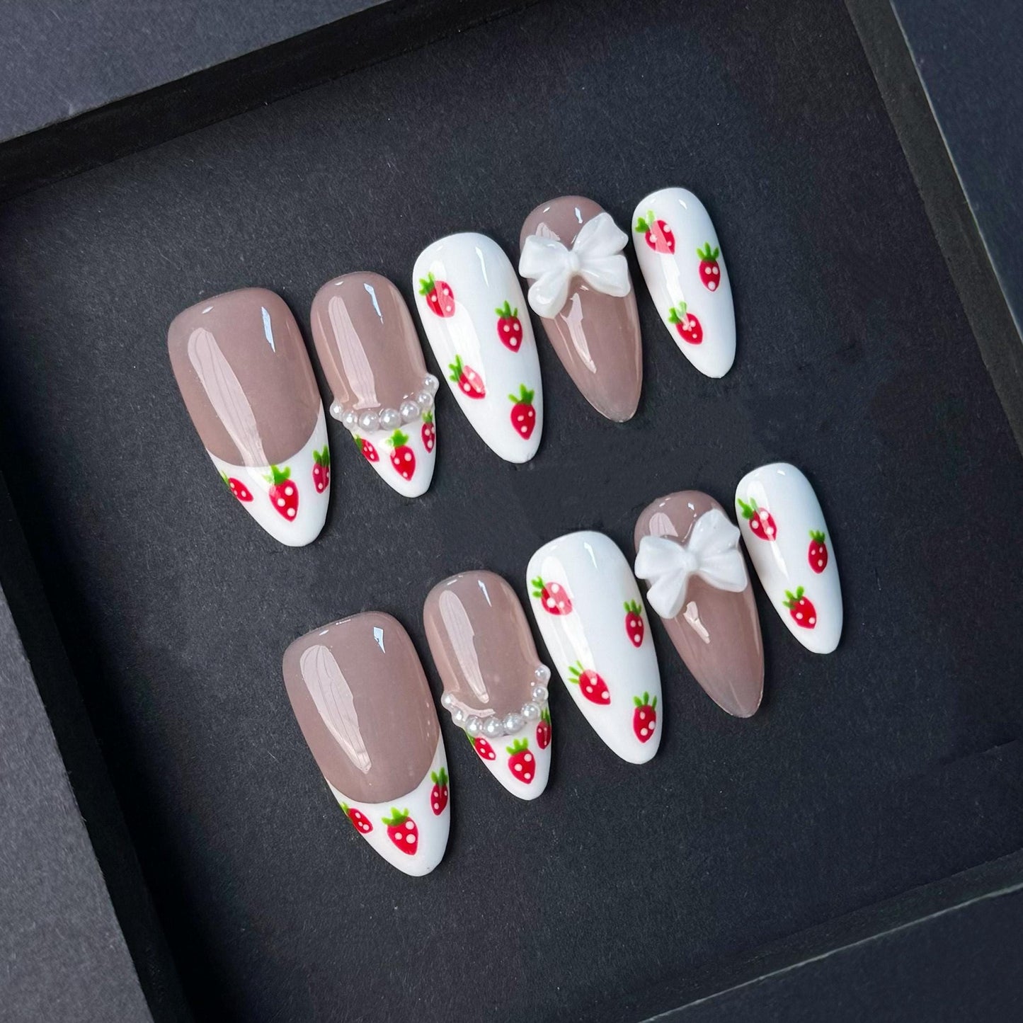 Cute Strawberry French Tip Nails with Pearls and Bows. Kawaii Press-On Set. Artificial reusable fake glue on faux manicure nails trendy art.