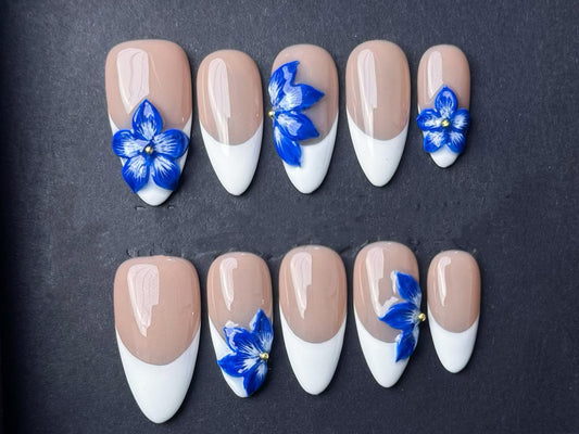 3D blue floral white French tips nude base handmade press-on elegant floral art cobalt flowers minimalist chic glossy finish spring bridal