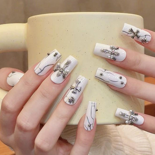 White Marble Cross Charm Press-On Nails – Gothic Luxe Coffin Set glue on gothic glam elegance and edge silver cross bow and crystal charms