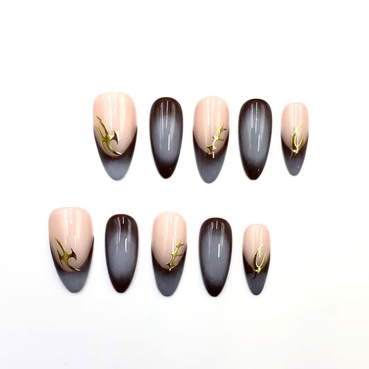 Nude black ombré nails almond-shaped press-on gold nail art elegant manicure minimalist nail style modern nail fashion, glossy subtle luxury