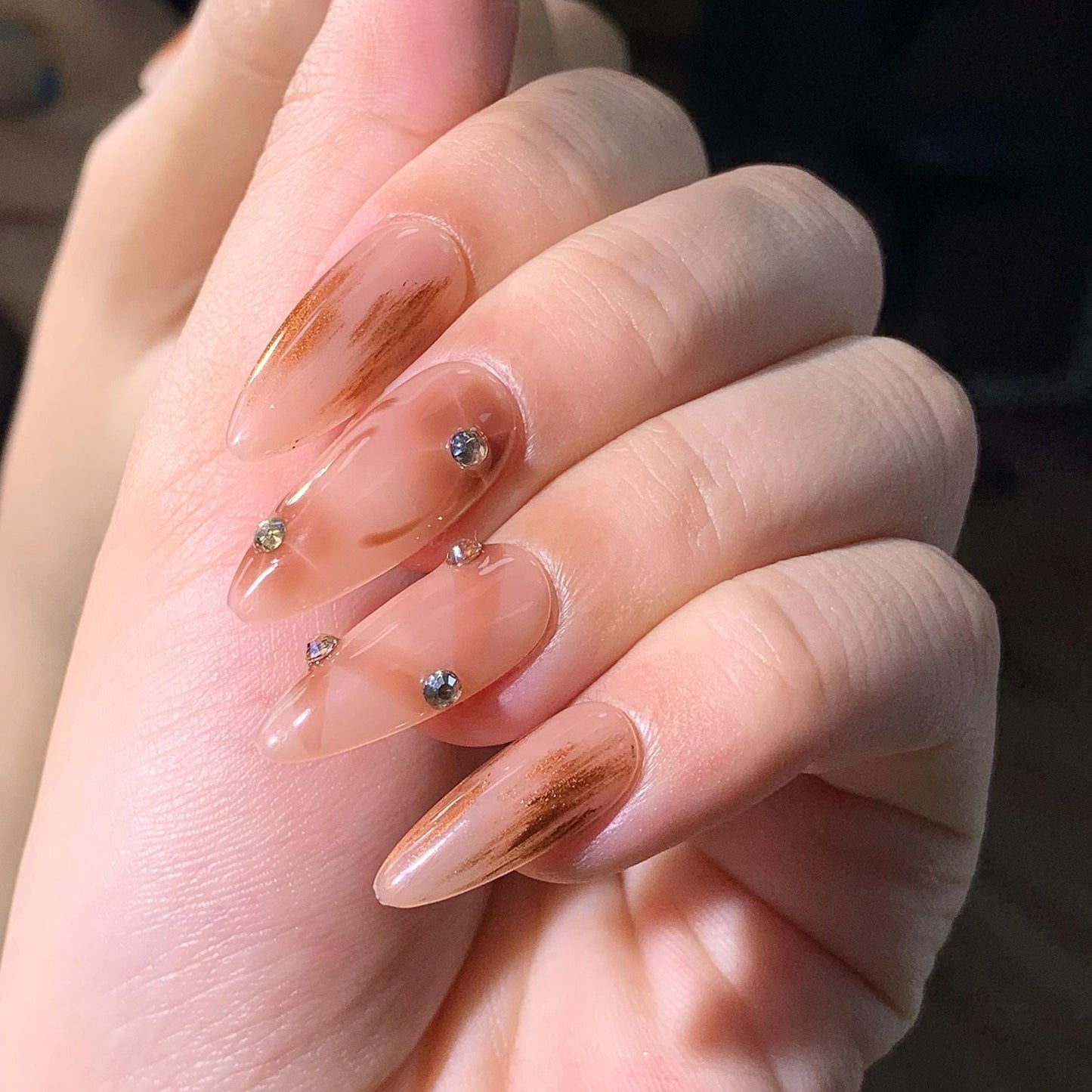press-on nails nude almond shape glossy finish marble design rhinestone transparent elegant design handmade chic style brown accent luxury