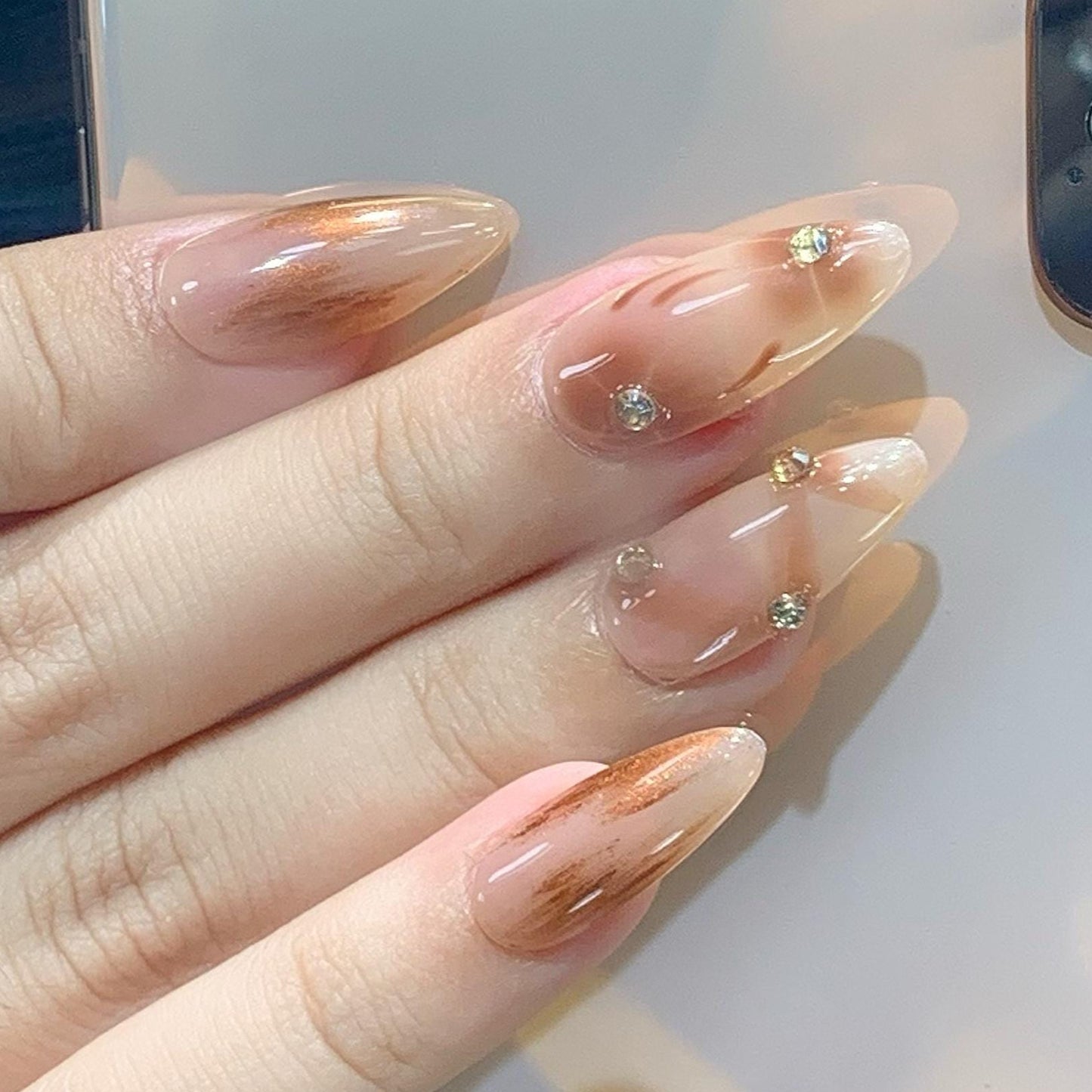 press-on nails nude almond shape glossy finish marble design rhinestone transparent elegant design handmade chic style brown accent luxury