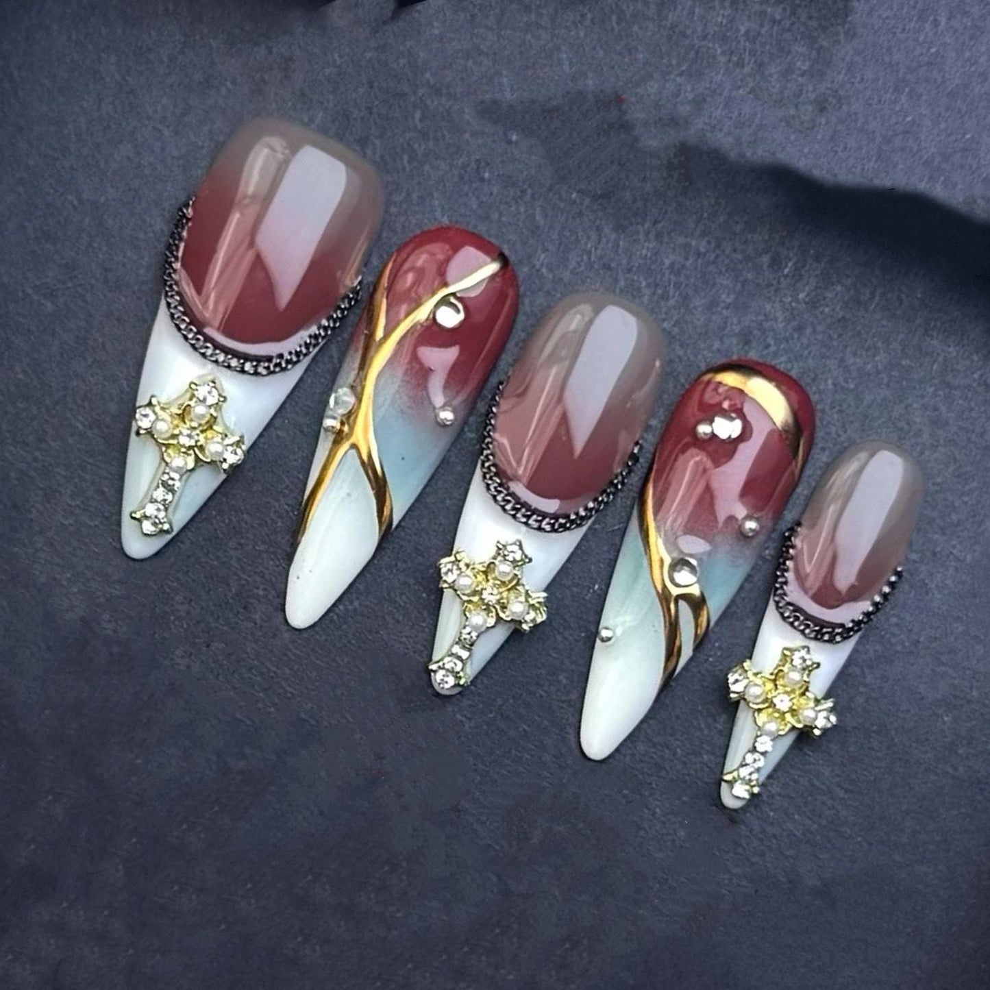 Gothic Elegance Press-On Nails with Gold Cross Charms. Burgundy and Marble Stiletto Set. Artificial reusable glue on faux nails trendy art.