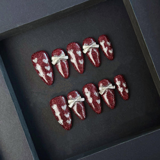 Burgundy Glitter Press-On Nails with Silver Hearts and 3D Bows. Artificial reusable fake glue on faux manicure nails trendy art.