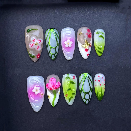 3D Tropical Garden Press-On Nails with Jungle Leaf and Flower Accents. Medium Almond. Artificial reusable fake glue on faux nail trendy art.