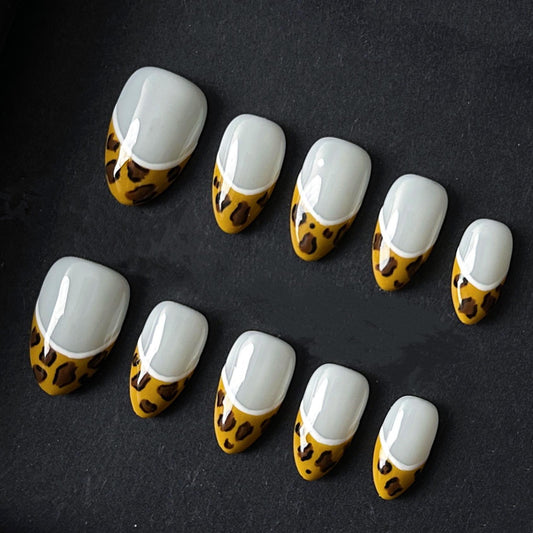 Glossy French Tip Press On Nails with Mustard Leopard Print Accent. Artificial reusable fake glue on faux manicure nails trendy art.