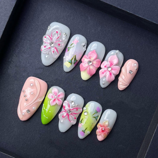 Spring Floral Garden Press On Nails with 3D Flowers and Pastel Accents. Artificial reusable fake glue on faux manicure nails trendy art.