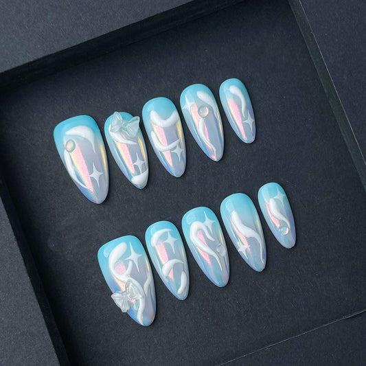 Iridescent Blue Aurora Press-On Nails with 3D Swirls and Star Glow Accents. Artificial reusable fake glue on faux manicure nails trendy art.