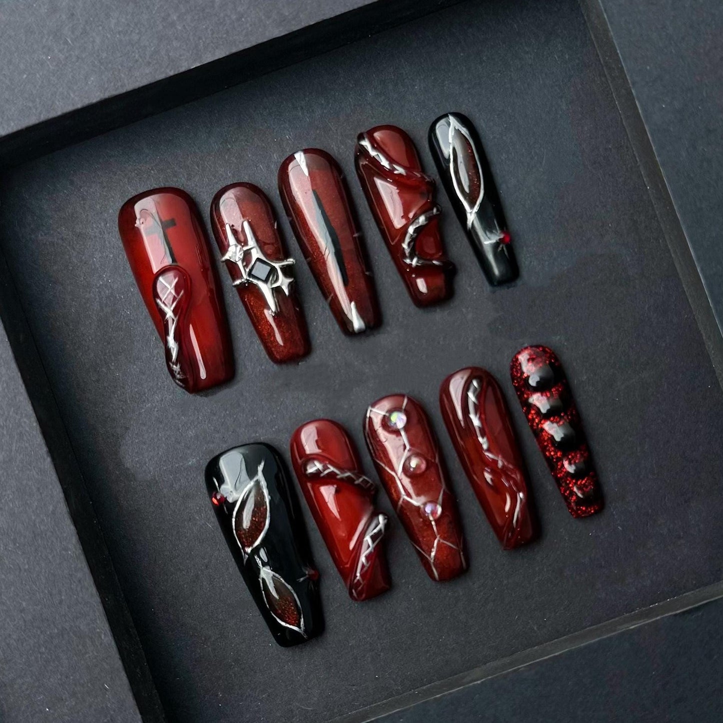 Deep Red and Black Gothic Press-On Nails with Chrome & Crystal Accents. Artificial reusable fake glue on faux manicure nails trendy art.