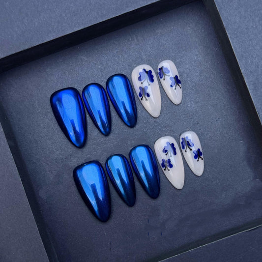 Iridescent Sapphire Blue and Floral White Press-On Nails. Artificial reusable fake glue on faux manicure nails trendy art.