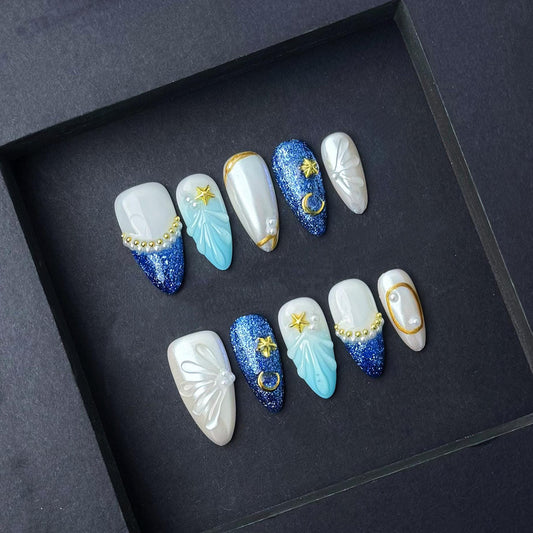Celestial Ocean Fantasy Press-On Nails – Blue Glitter & Pearl Star Accents. Artificial reusable fake glue on faux manicure nails trendy art.