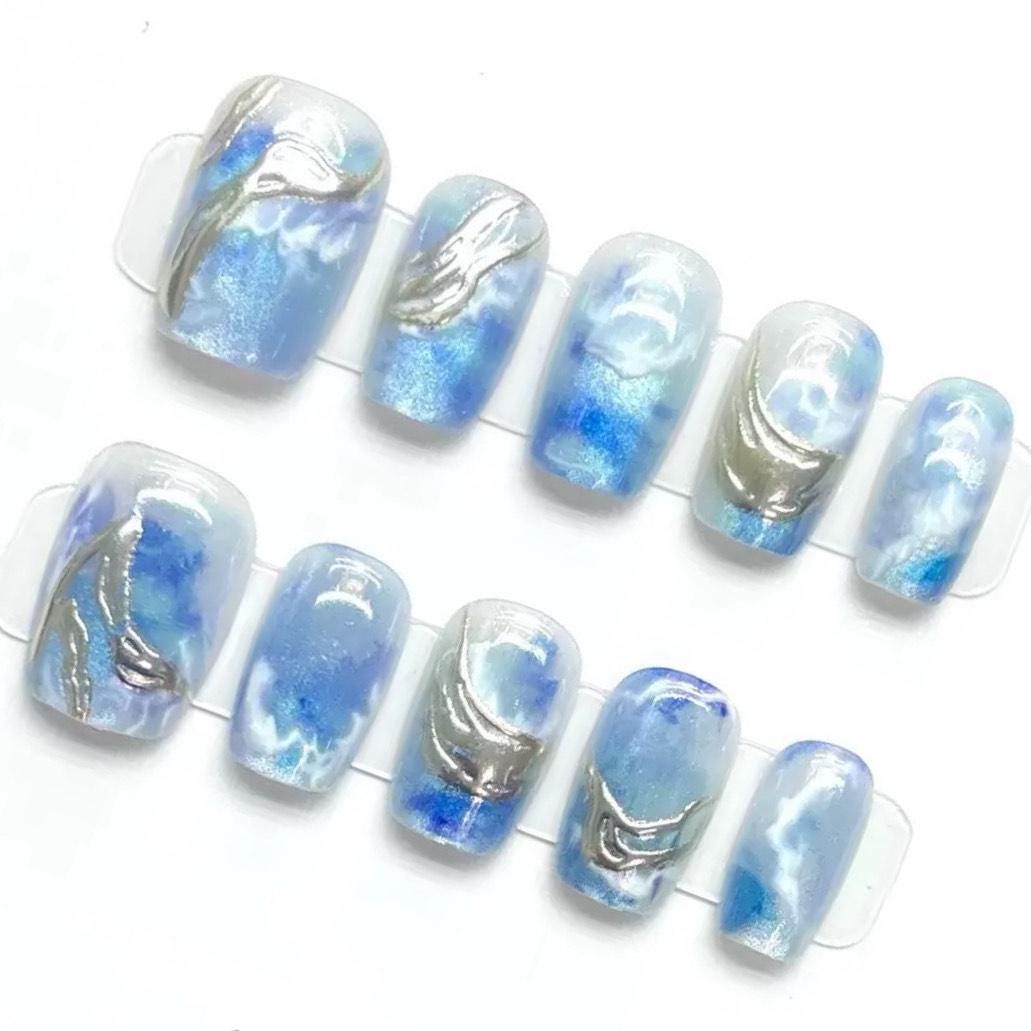 Ocean Swirl Blue Marble Press-On Nails with Silver Wave Accents. Artificial reusable fake glue on faux manicure nails trendy art.