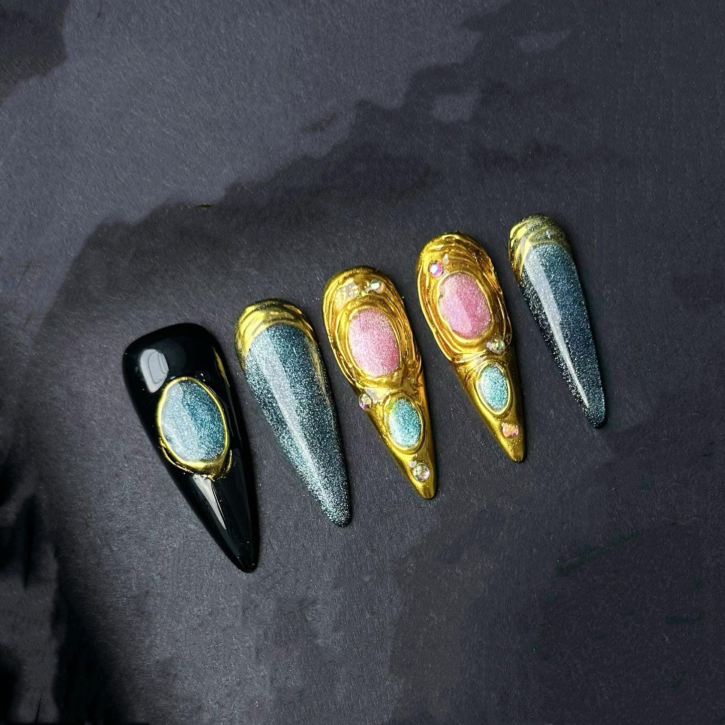 Celestial Metallic Galaxy Press-On Nails with Gold Sculpted Detail and Gem Accents. Artificial reusable fake glue on faux manicure nail art.