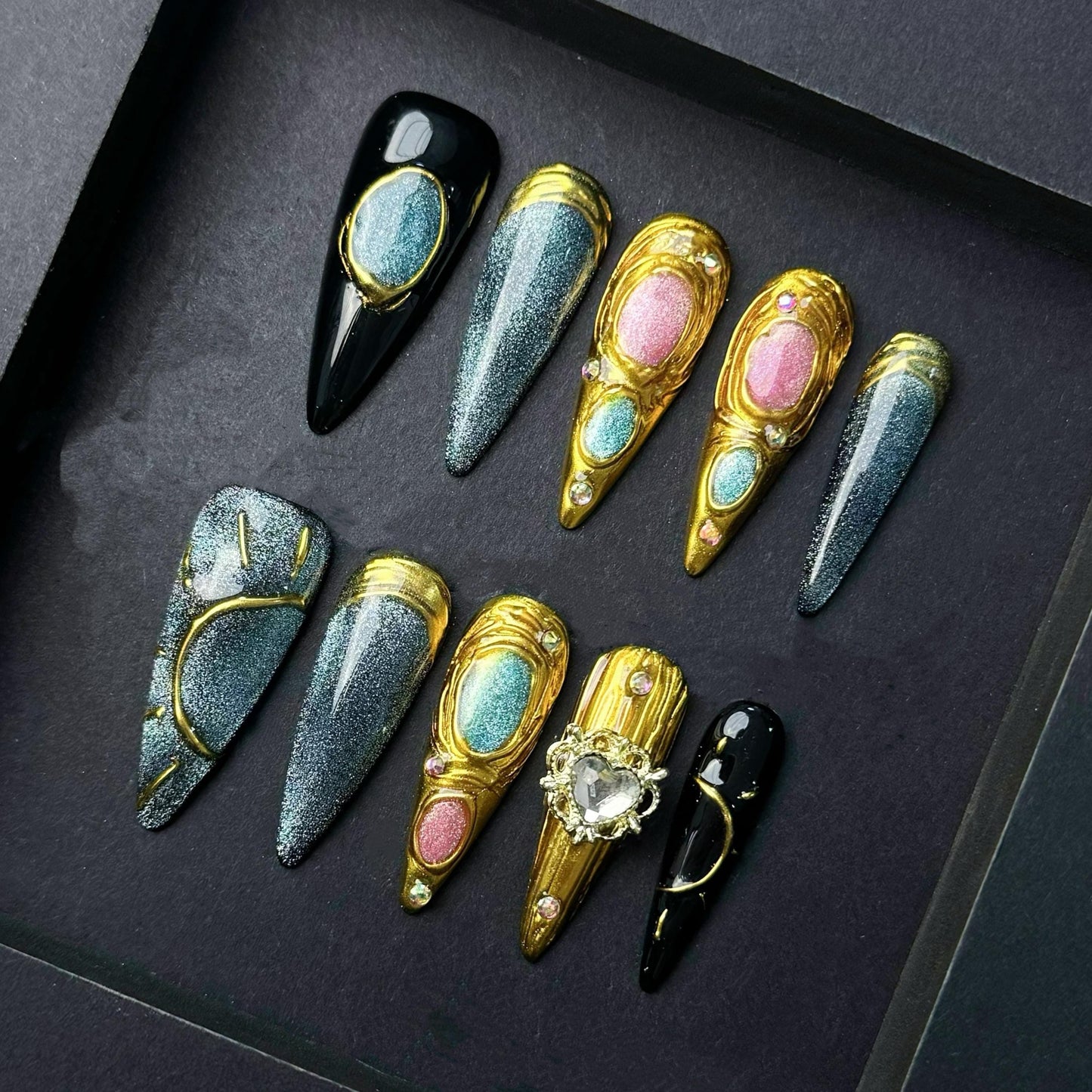 Celestial Metallic Galaxy Press-On Nails with Gold Sculpted Detail and Gem Accents. Artificial reusable fake glue on faux manicure nail art.